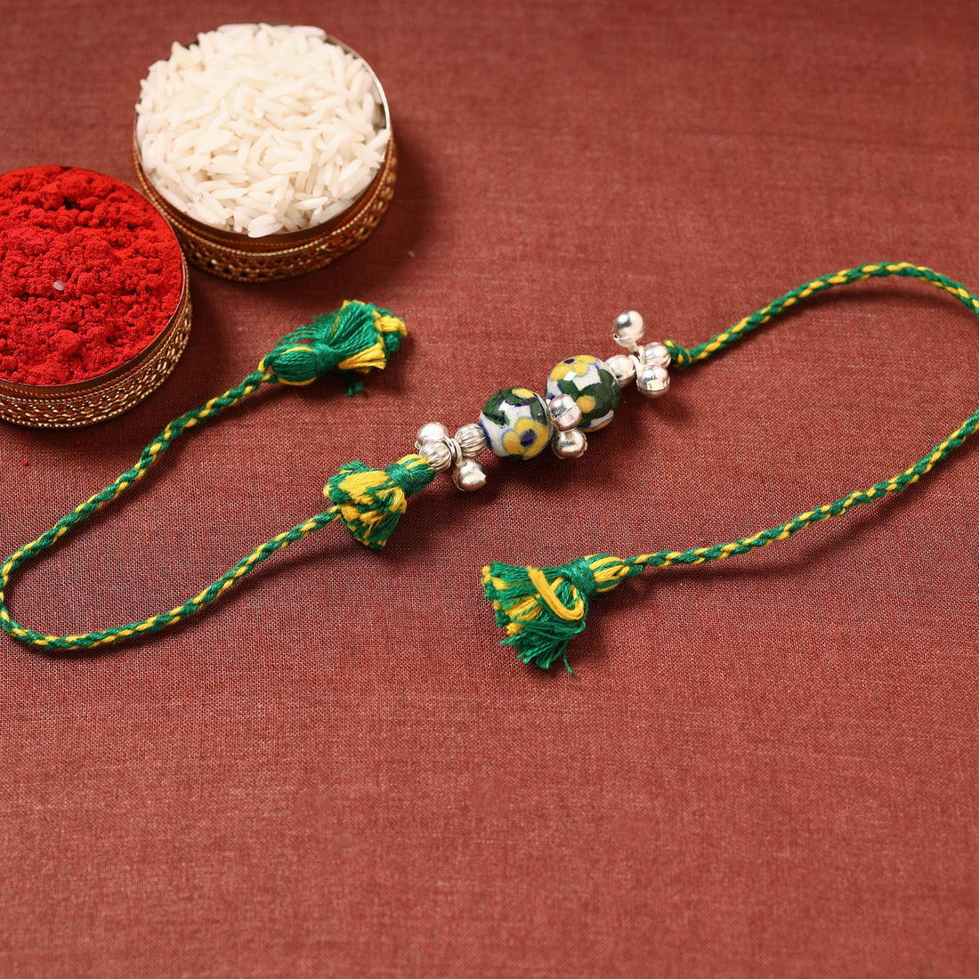 Handcrafted Patwa Threadwork Blue Pottery Beads Rakhi, green